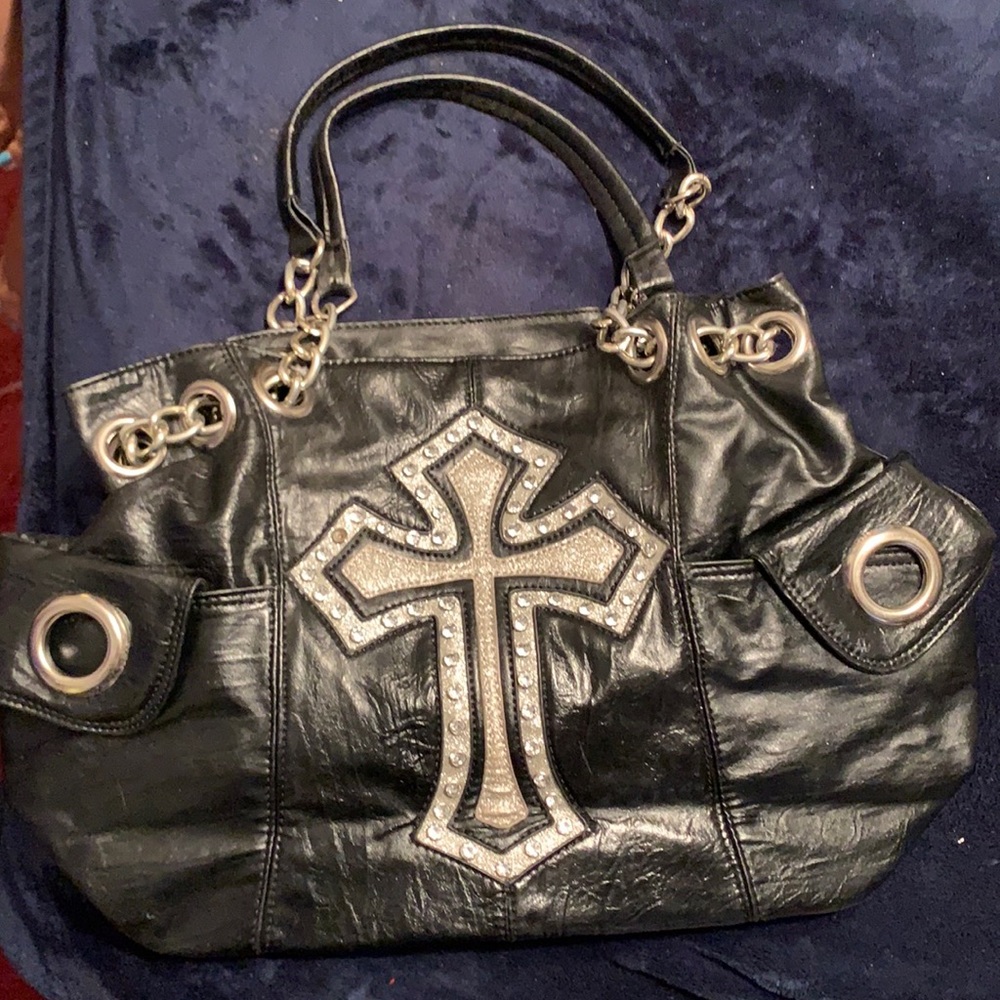 Black purse with rhinestone details.